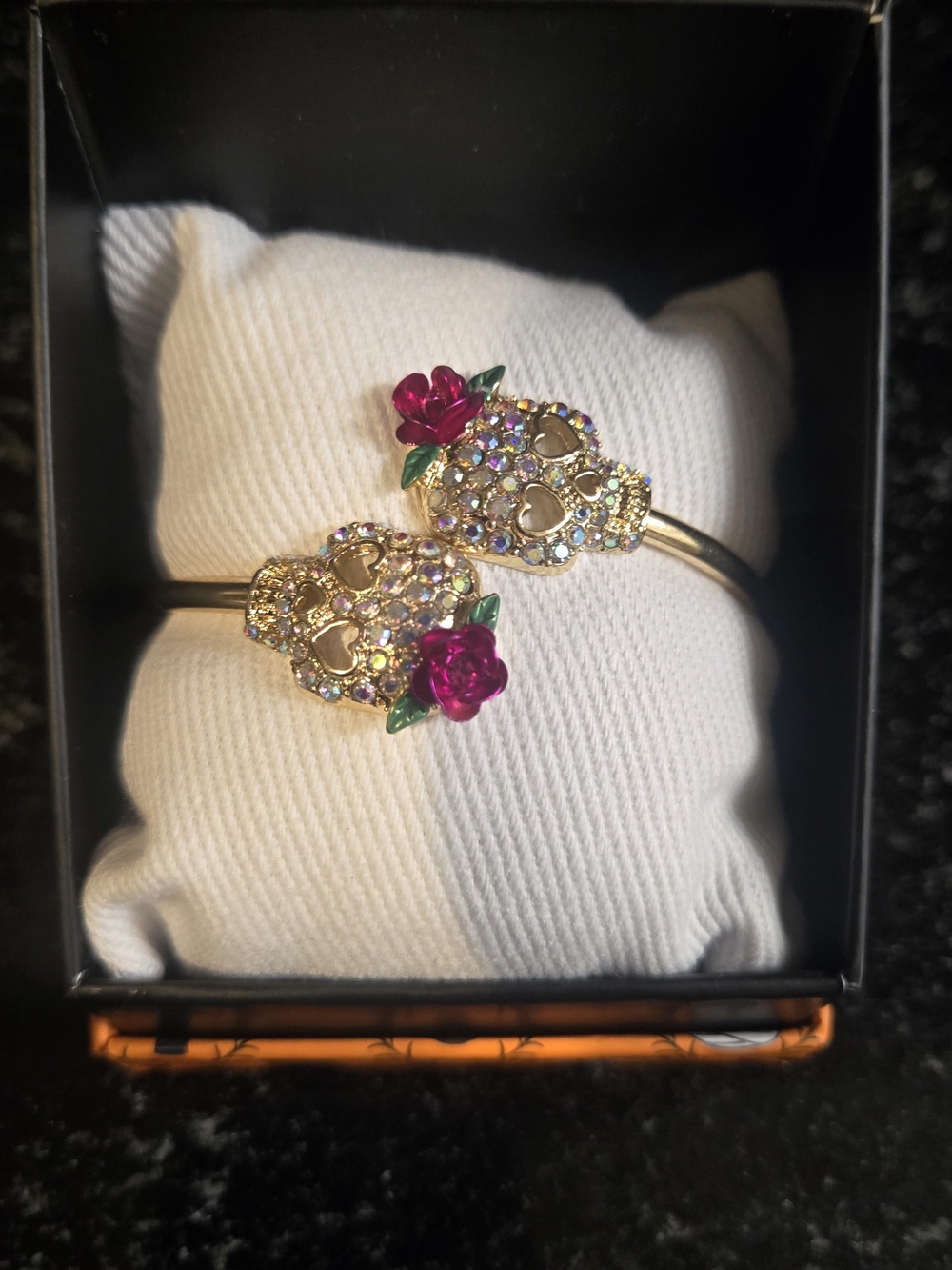 Gold-Tone Skull Cuff Bracelet with Pink Rose Accents